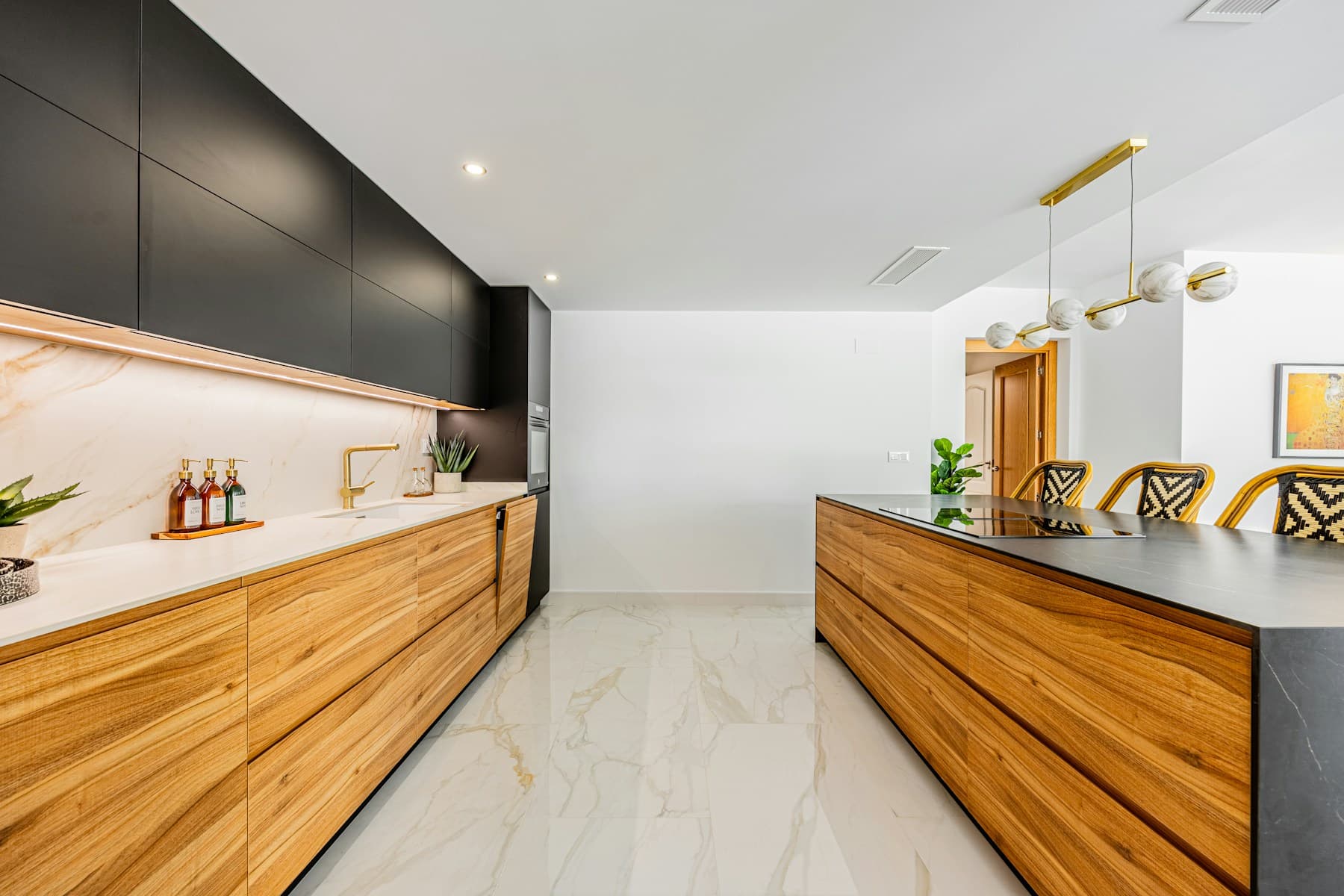 Bright, polished kitchen interior with warm wood cabinetry and clean counters.